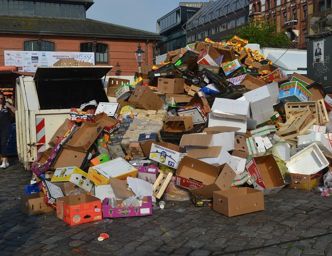 Loose cardboard boxes piled up outside a building
