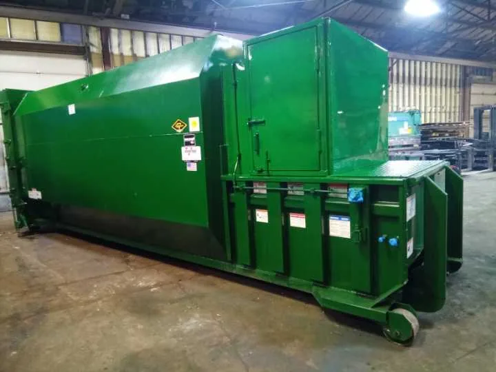 A rebuilt green compactor in the MCS Midwest shop