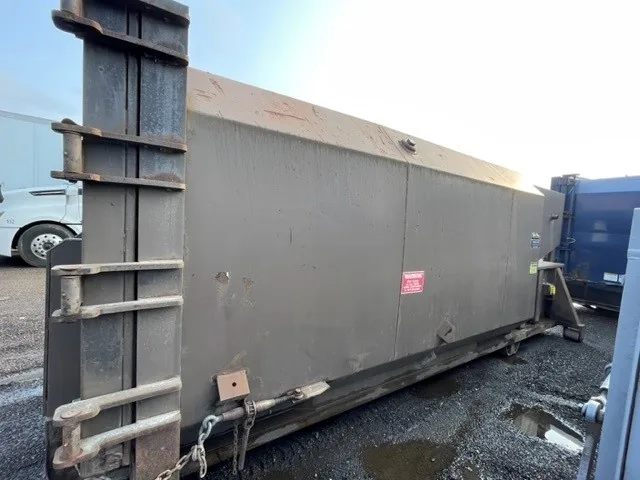 A weathered steel container awaiting refurbishment